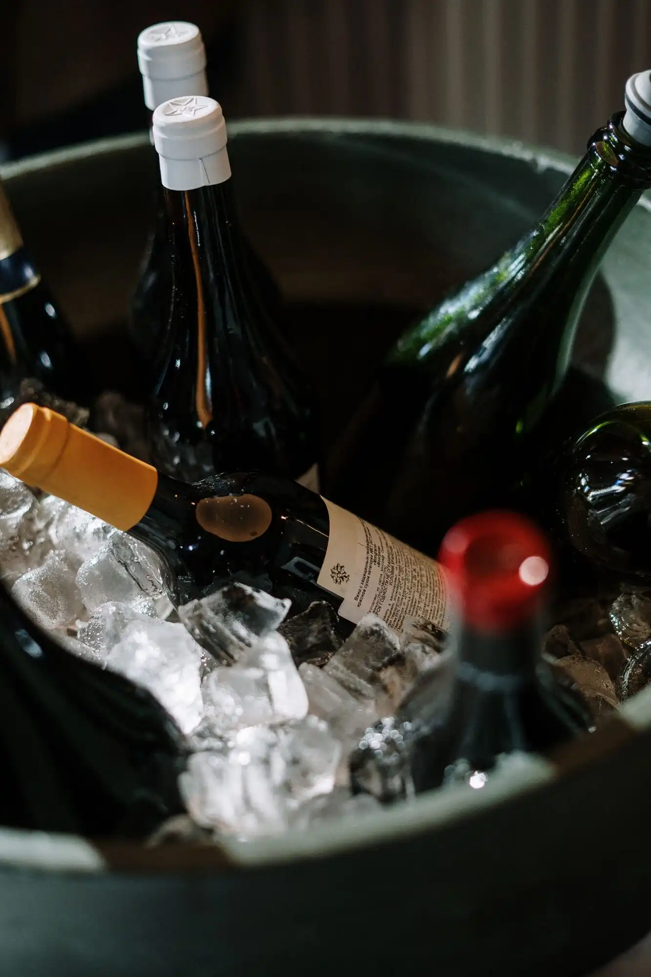 Bottles on ice at the bar